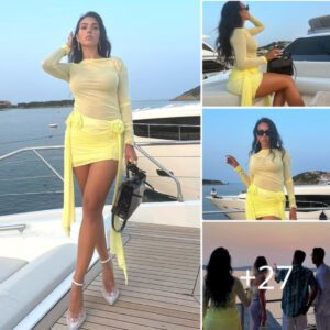 Rodriguez Radiates Elegance: Stunning Photos Capture Her in a Sheer Yellow Mini Dress on a Yacht in Italy.