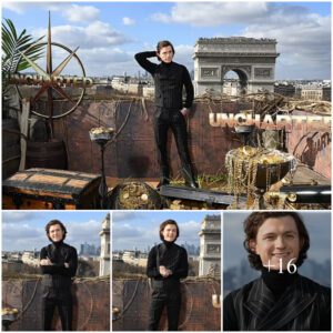 Tom Holland looks dapper as he teams a pinstripe waistcoat and trousers with a polo neck jumper at a photoshoot in Paris for his new film Uncharted