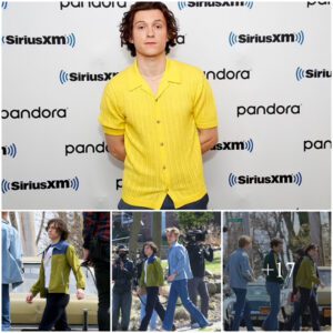 Tom Holland sports wavy hair and 1970s attire as he throws himself into character on the set of anthology series The Crowded Room