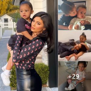 Warm moment: Stormi takes care of her younger brother Aire and "rocks" mom Kylie Jenner to sleep