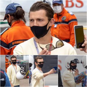 Tom Holland dons a pale yellow sweater and shades (and tries on a crash helmet) as he attends the F1 Grand Prix in Monaco