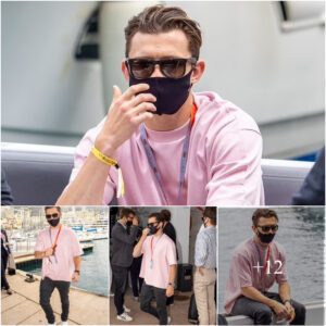 Tom Holland cuts a casual figure in a pink T-shirt and black jeans as he attends the F1 Grand Prix qualifying in Monaco