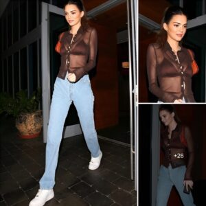 Kendall Jenner's daring style moment in Miami! She confidently flaunts her bra under a sheer blouse, adding a hint of allure with a missing button.