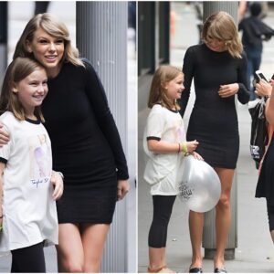 Her lucky day! Taylor Swift pulls her car over to meet young fan after spotting the girl wearing one of her concert T-shirts as she walked down the street in Sydney