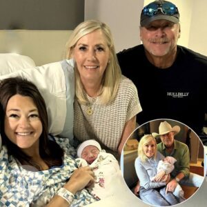 Country music fans are in a tizzy after a candid photo of Alan Jackson surfaced, not on stage, not in a recording studio, but as a proud grandfather holding his newborn grandchild.