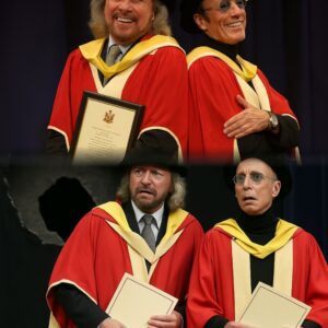 UNEXPECTED INCIDENT: During a Ceremony at the University of Manchester, Where Bee Gees Members Barry (left) and Robin Gibb Were Honored with an Honorary Doctorate in Music
