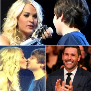"He Asked… And She Actually Said Yes?!" Carrie Underwood stopped an entire arena cold when a bold young fan held up a daring sign