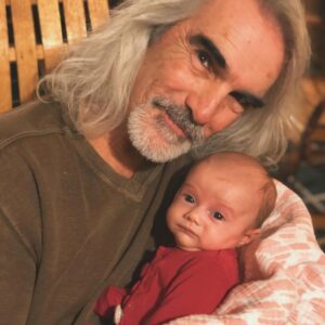 PURE LOVE: Guy Penrod Cradles His Grandchild in a Moment That Melts Hearts. ws