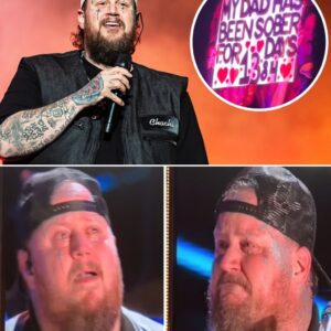 In the middle of a roaring concert, Jelly Roll suddenly stopped, his eyes locked on a sign in the crowd: “1,384 days sober.” Without a second thought, he jumped off the stage and walked straight into the sea of fans.