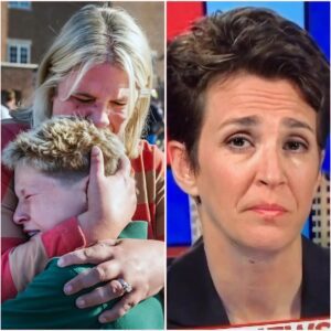 Heartbroken in tragedy: A mother holds her son in the immediate aftermath of the horrific shooting at Mass at the Announcement Catholic School in Minnesota