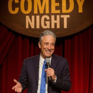Jon Stewart revealed that two anonymous Powerball winners offered $800 million for a charitable comedy and music tour.