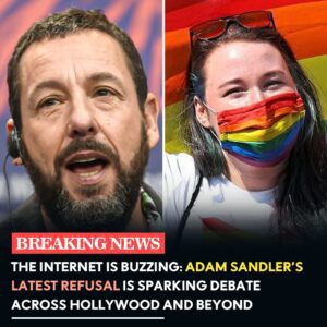In the spotlight of a sold-out arena, comedy king Adam Sandler gripped his guitar like a rebel flag—then tossed aside the rainbow strap producers had slipped onto it, his face a storm of defiance. "I'm done with this forced symbolism,"