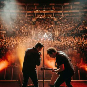 The moment Steve Perry stepped into the soft glow of the stage lights, the air shifted. - convoGD