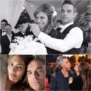 🔥 “The whole world thinks she’s with me for the fame — but they don’t see the nights she waits up for me after every show.” – Robbie Williams 💔